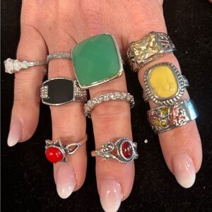 10 silvertone costume rings sizes  8,9,10.
Variety of shapes and colors.